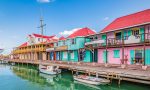 Colorful buildings dot the coast of a marina in Antigua