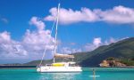 Paddle boarding while on a yacht charter in the BVI