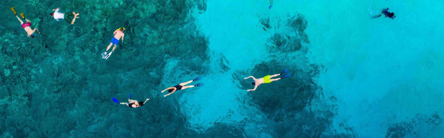 snorkeling near Cala Xarraca on a catamaran